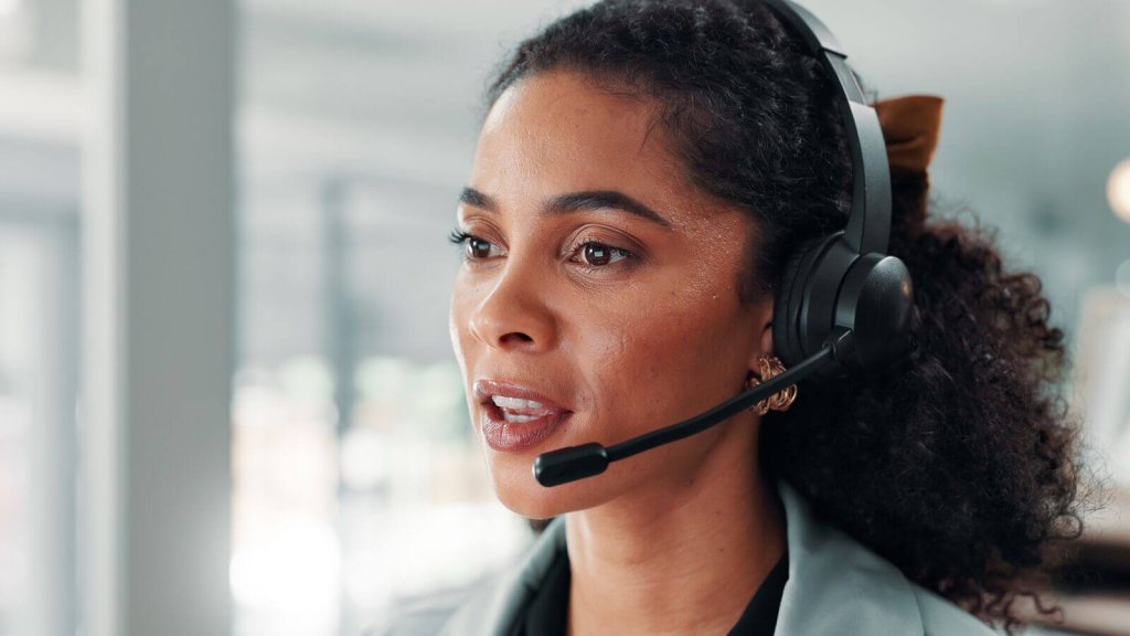 Call handler wearing a headset.