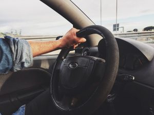 hands on the wheel of a car